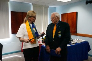 Sophie, Countess of Wessex being presenting with a scarf and tie from Mr. Steve Stoute, President of the Barbados Olympic Association